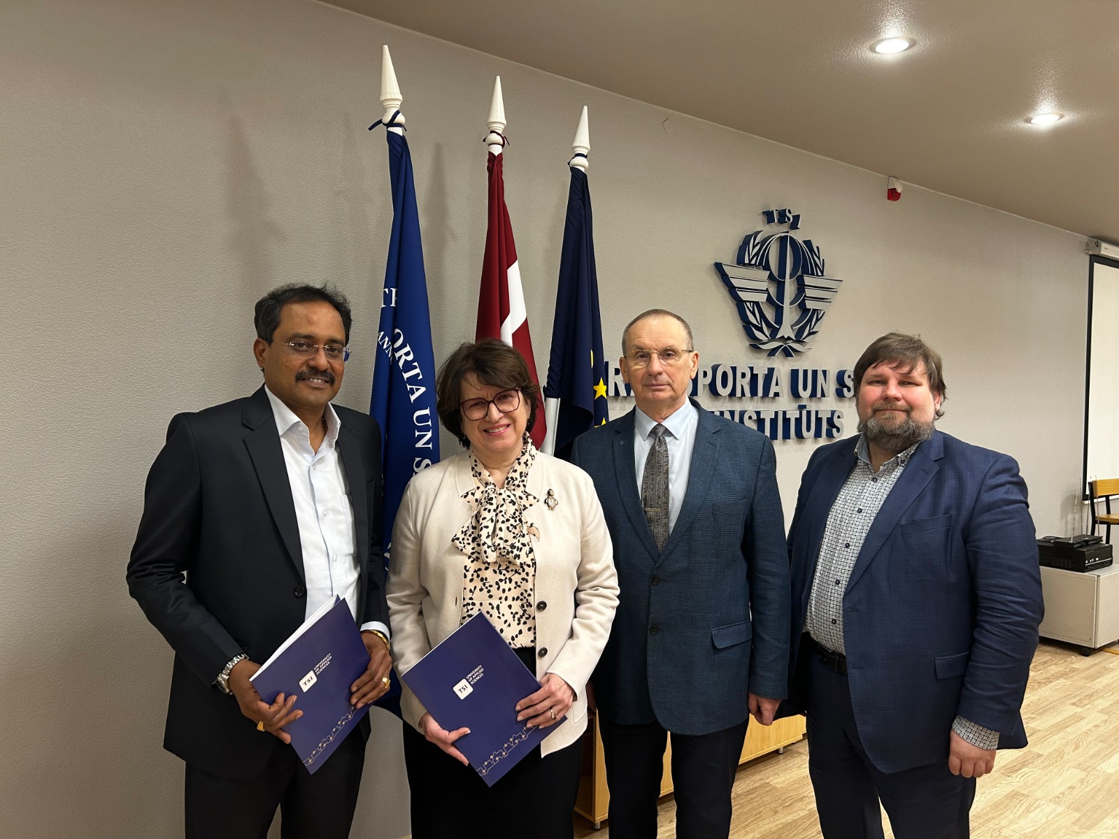 Officials exchanging partnership documents